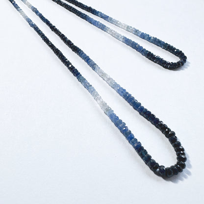Shaded blue sapphire rondelle beads  sparkle across a 40cm strand with rich tonal variation.