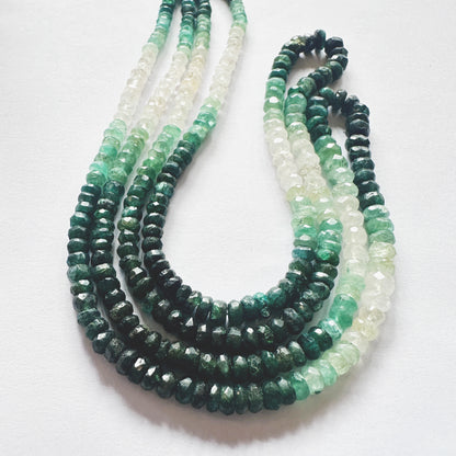 Shaded Emerald gemstones with consistent cut and shine positioned across full strand length.
