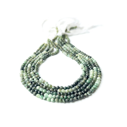 Shaded Emerald smooth round beads in 4–4.2mm, showing deep to light green tones for handmade jewellery components.