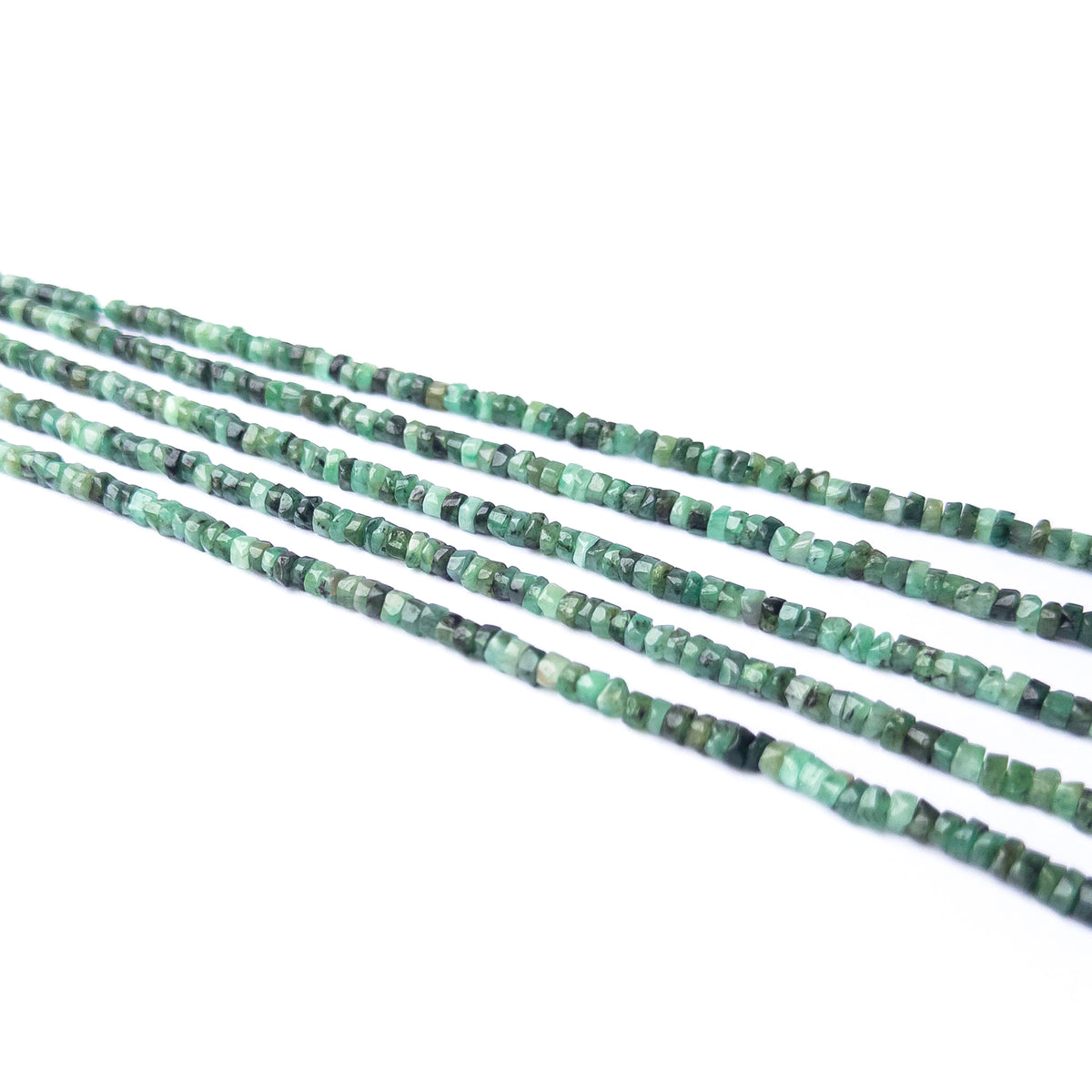 Handmade jewellery components featuring Shaded Emerald Heishi beads in elegant green hues.