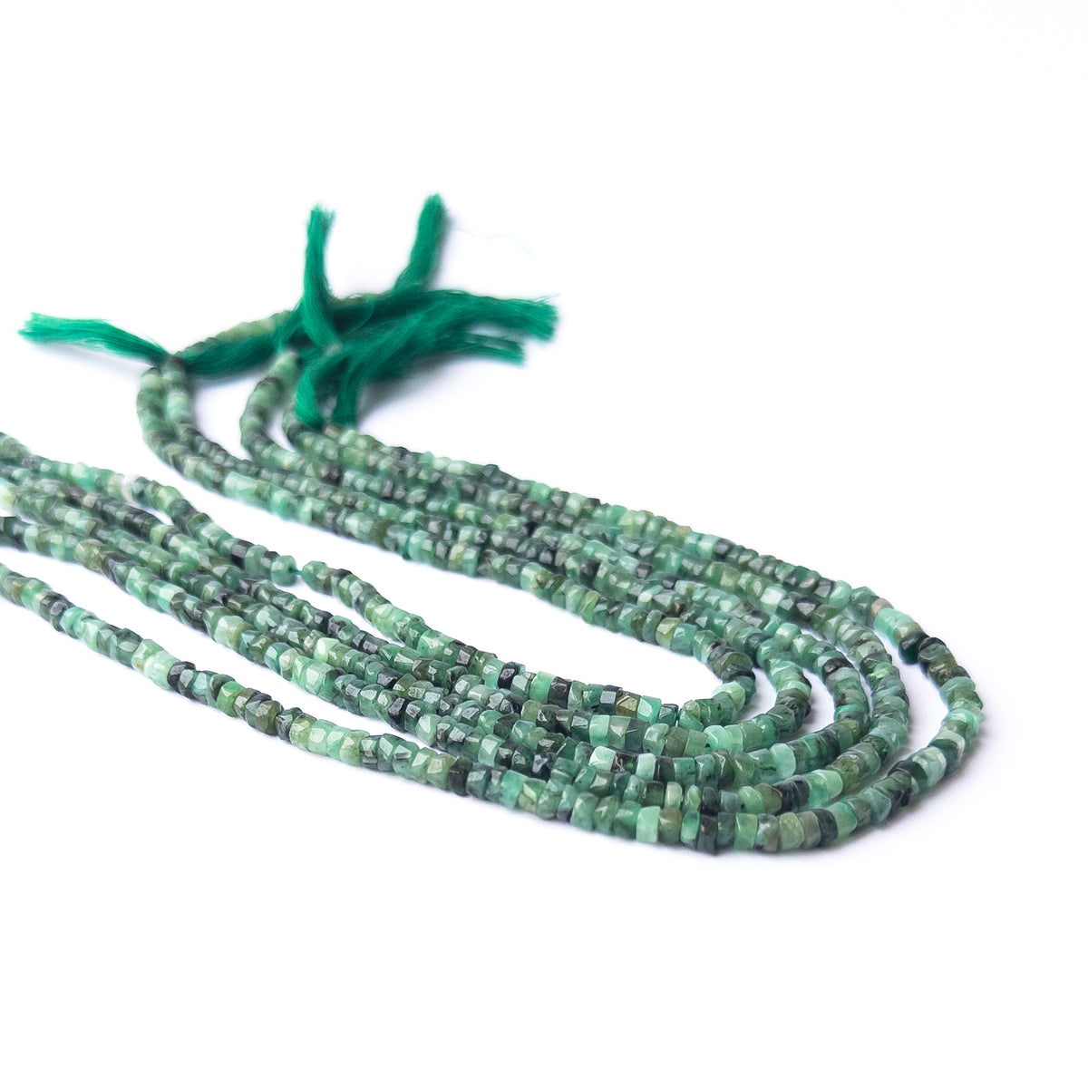 Shaded Emerald Smooth Wheel Heishi beads in uniform 4–4.2mm size for handmade jewellery components.