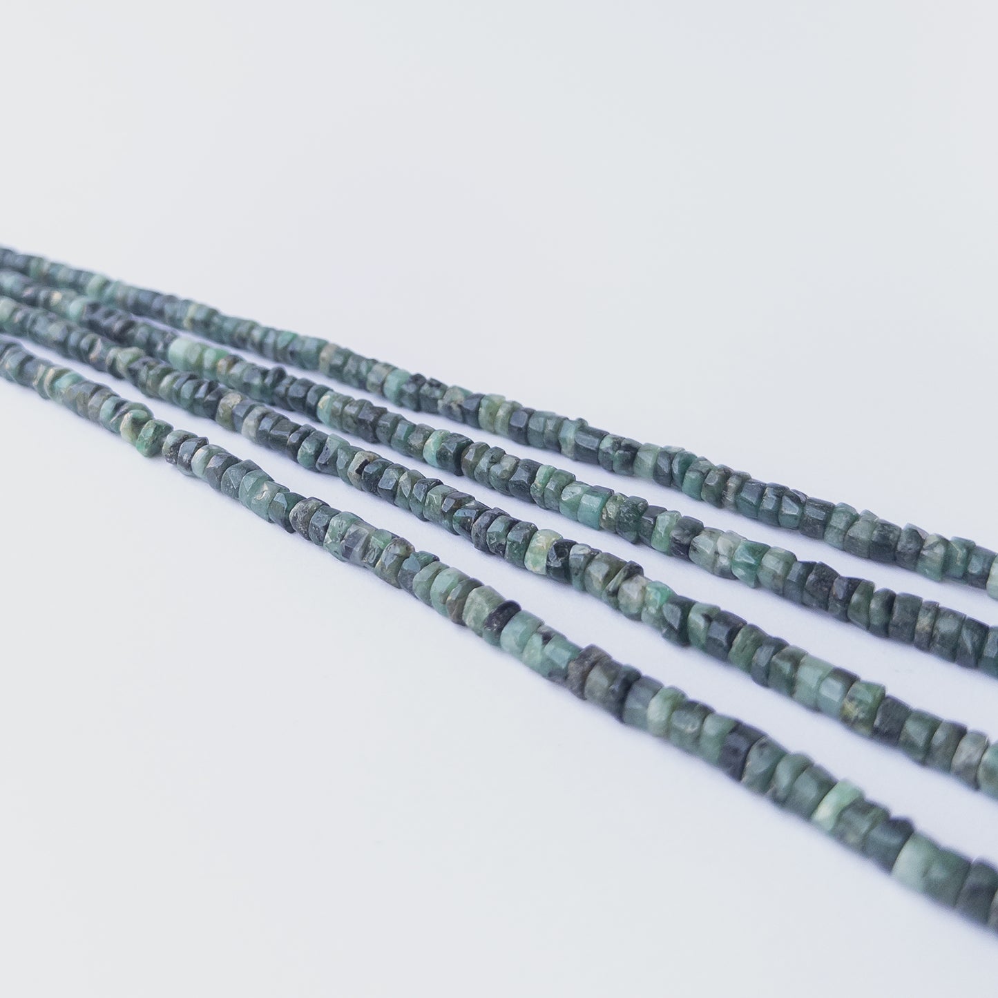 Genuine Shaded Emerald gemstone beads with smooth wheel cut, perfect for artisan jewellery designs.