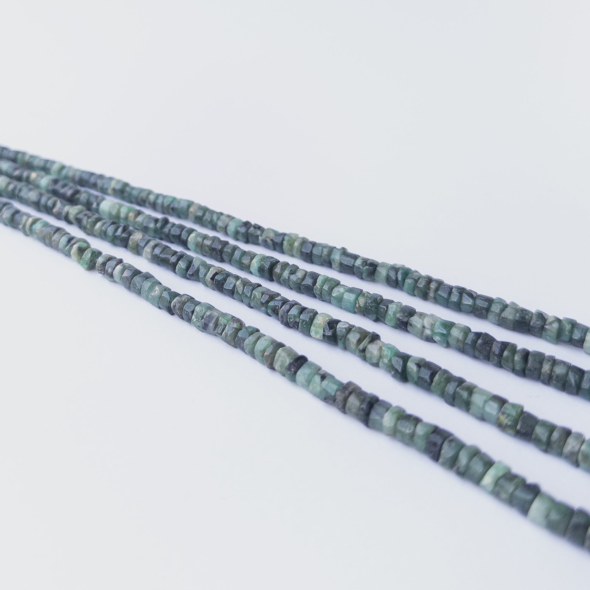 Genuine Shaded Emerald gemstone beads with smooth wheel cut, perfect for artisan jewellery designs.
