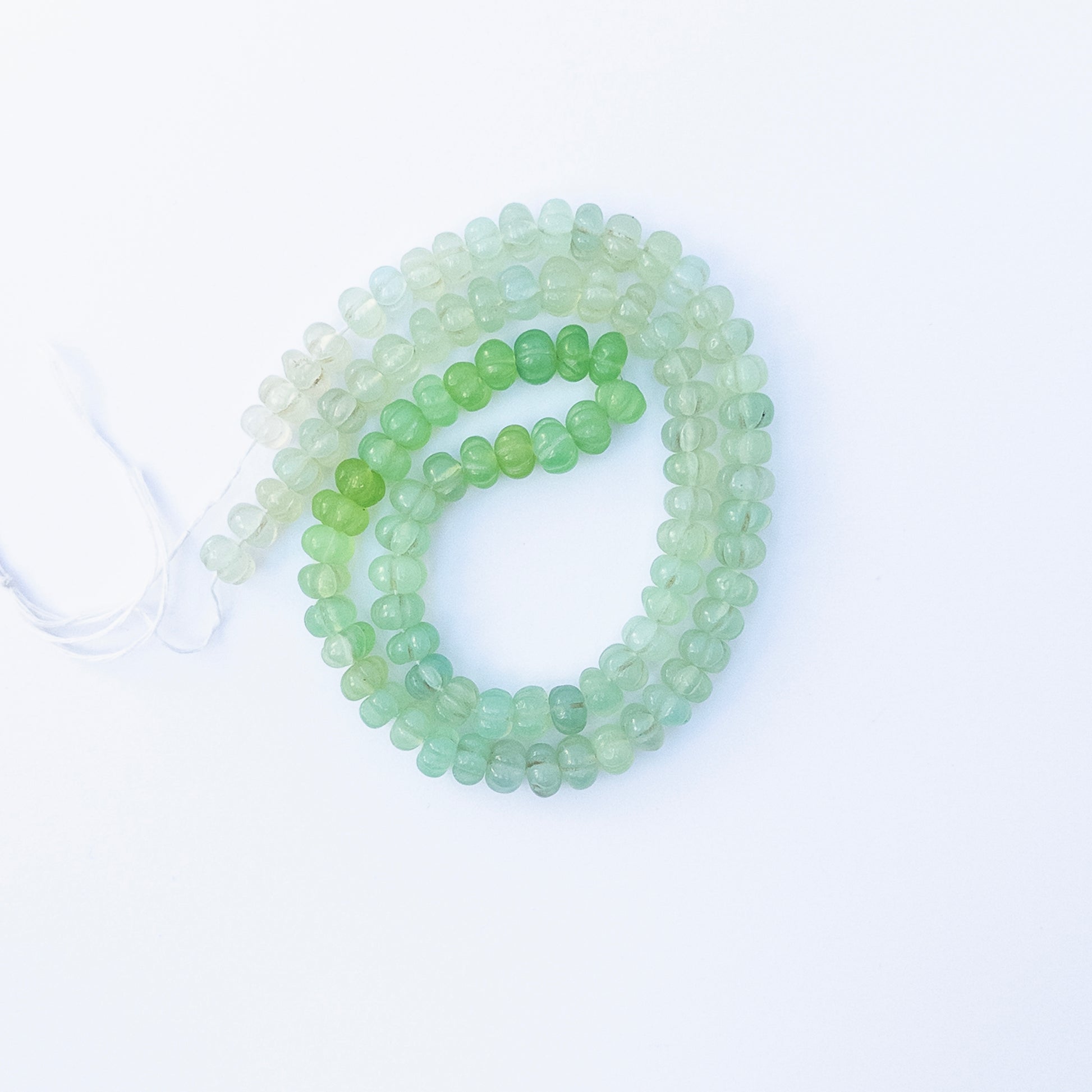 Authentic Shaded Green Chalcedony pumpkin cut stone beads for DIY jewellery, showcasing vibrant colour and fine craftsmanship.