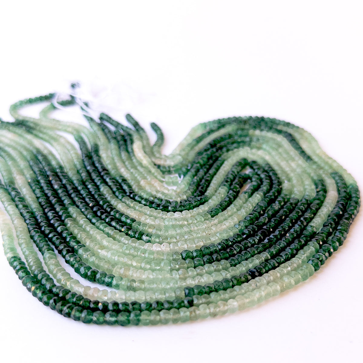 Authentic Shaded Green Quartz gemstone beads displaying gradient green hues and polished faceted shine