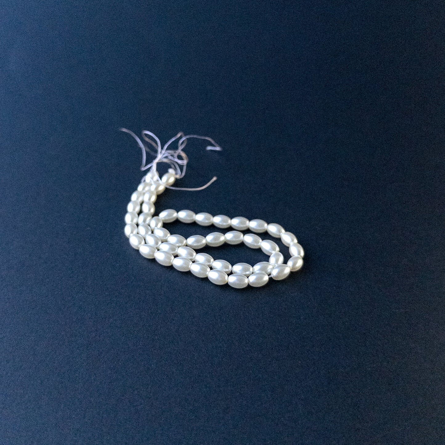 Genuine Shell Pearl stone beads in smooth oval cut showcasing soft lustre and elegant shine.