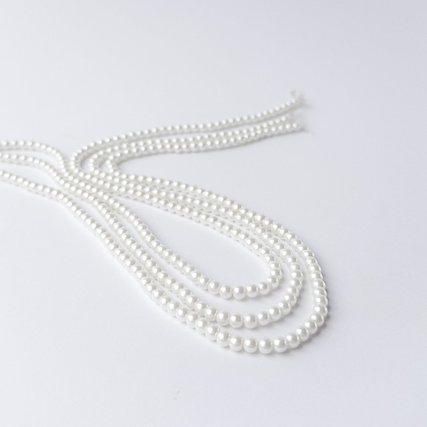 High-quality Shell Pearl beads arranged neatly for artisan jewellery and beadwork projects.
