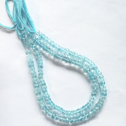 25cm strand of faceted Sky Blue Topaz beads arranged by size with radiant clarity.