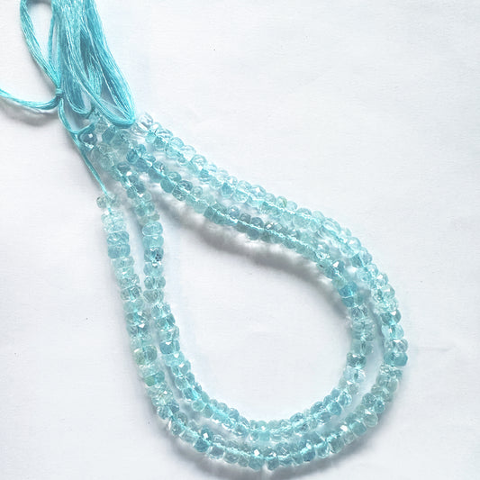 25cm strand of faceted Sky Blue Topaz beads arranged by size with radiant clarity.