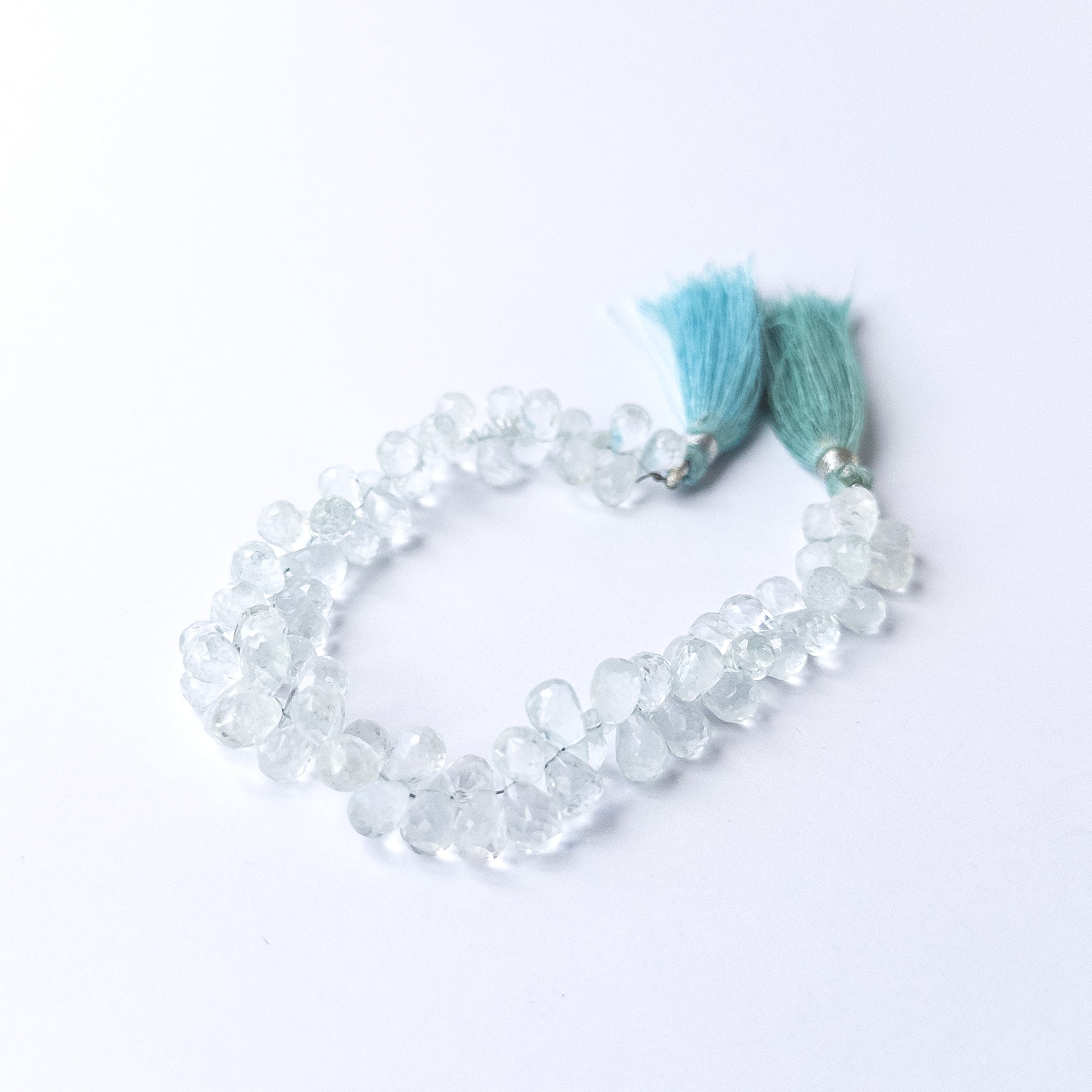 Sky blue Topaz faceted teardrop briolette beads shimmering on a 19cm strand for handmade jewellery components.