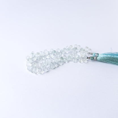 Authentic Topaz stone beads in teardrop briolette shape showcasing bright blue colour and high‑quality shine.