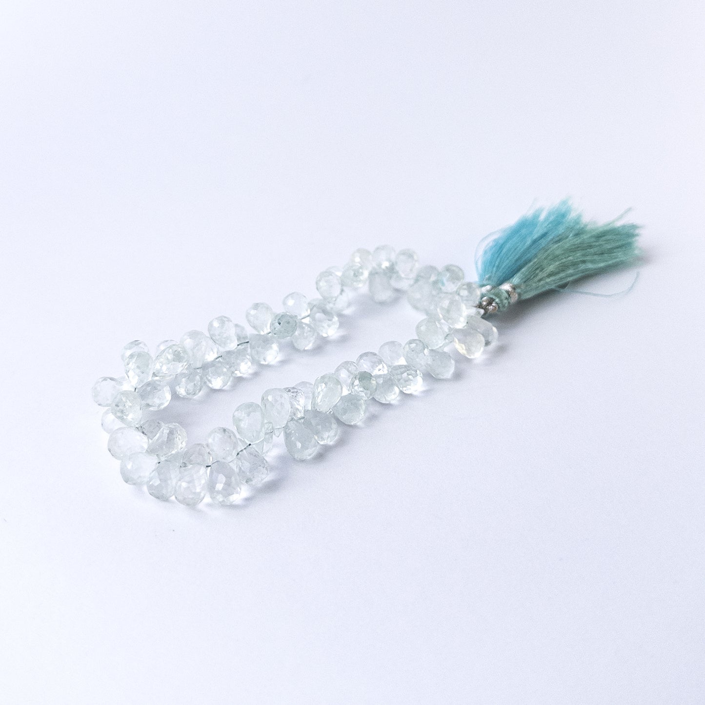 Genuine sky blue Topaz gemstone beads with sparkling faceted briolette cut, ideal for DIY jewellery making.