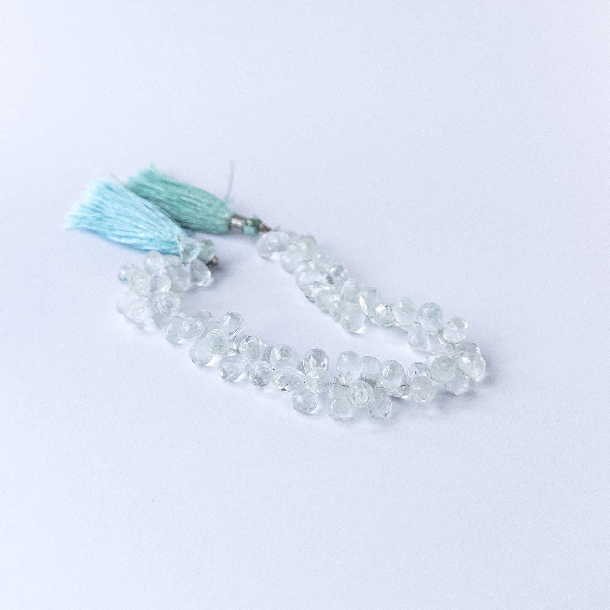 Handmade jewellery components featuring natural sky blue Topaz teardrop briolette beads with radiant sparkle.