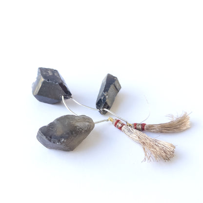 Smoky Quartz drilled rough beads with rugged surfaces and natural shine, perfect for authentic gemstone bead designs.