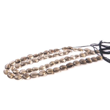 Authentic Smoky Quartz stone beads featuring faceted oval cuts that enhance light reflection and gemstone beauty.