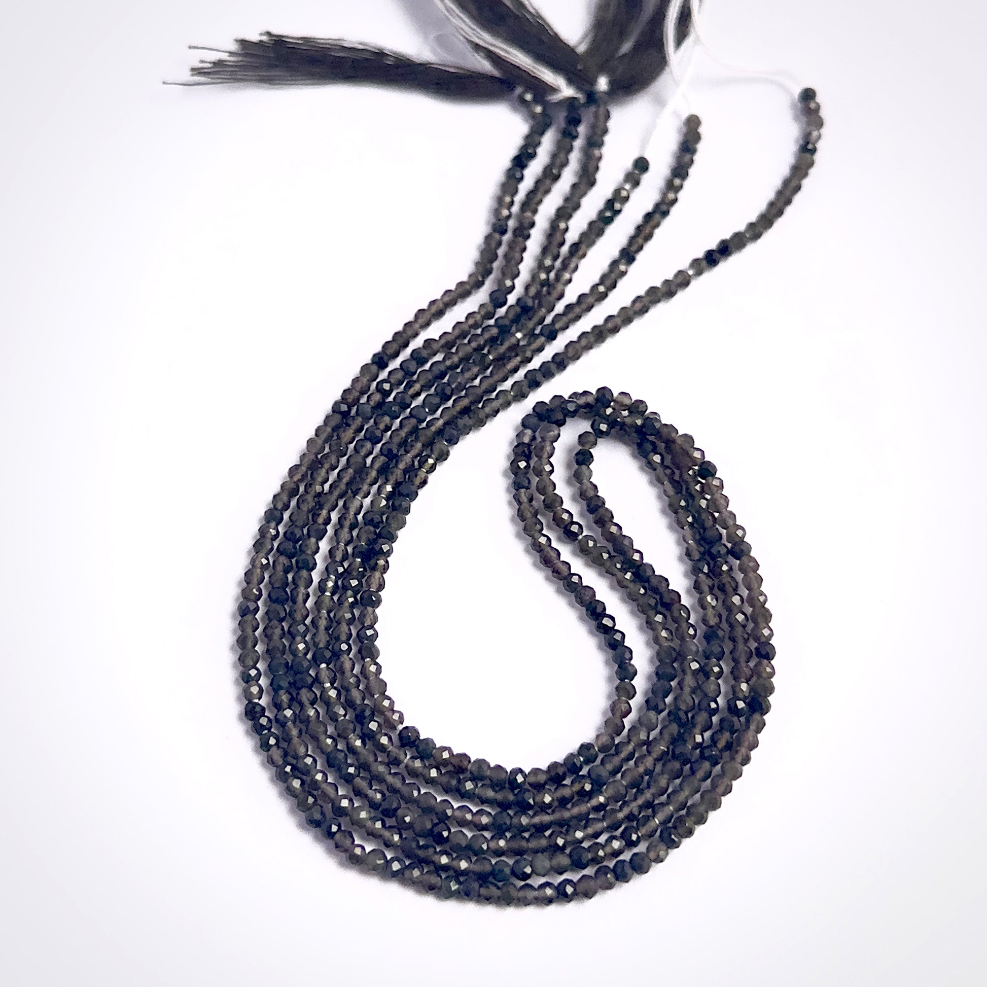 Smoky Quartz faceted rondelle beads in warm translucent brown tones on a 33cm strand.