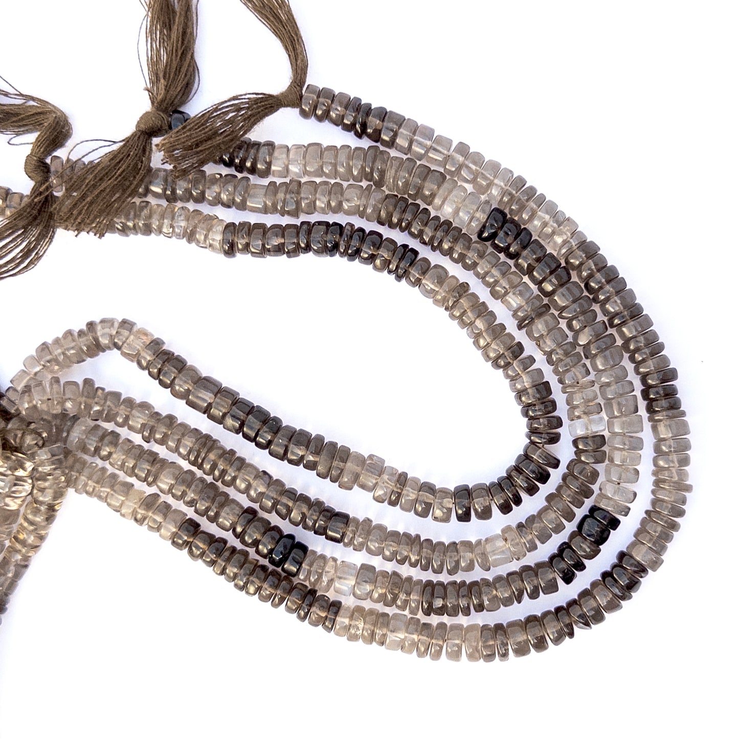 High‑quality Smoky Quartz stone beads in smooth rondelle cut, perfect for DIY jewellery makers seeking warm neutral tones.