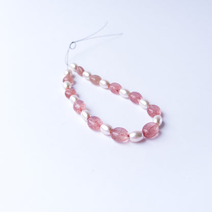 Strawberry Quartz and Shell Pearl smooth oval gemstone beads arranged neatly for DIY jewellery making.