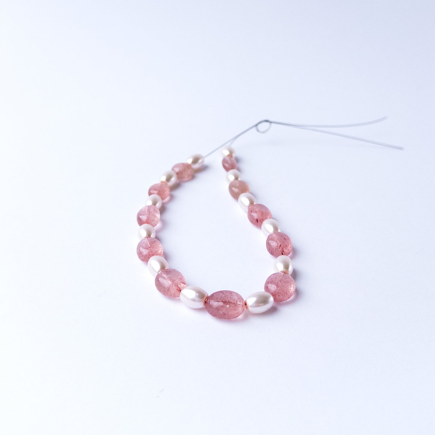 Authentic Strawberry Quartz and Shell Pearl stone beads showcasing polished shine and natural colour.