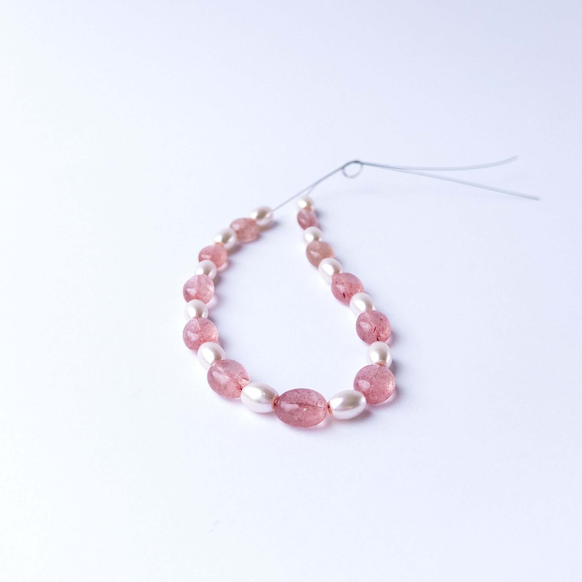 Authentic Strawberry Quartz and Shell Pearl stone beads showcasing polished shine and natural colour.