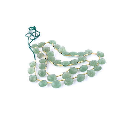 green Strawberry Quartz briolette beads featuring bright reflective shine, visible speckled inclusions, and consistent 10.3–13mm shaping.