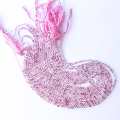 Strawberry Quartz faceted rondelle beads with natural variation, perfect for handmade jewellery components and creative beadwork.