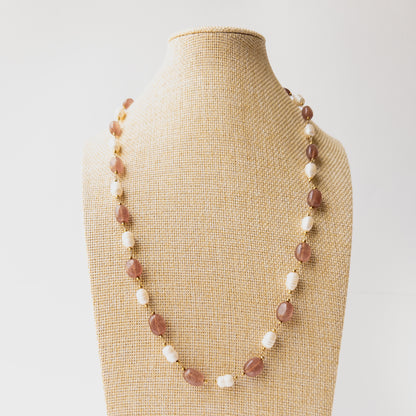 Strawberry Quartz and Freshwater Pearl necklace featuring smooth oval gemstones in soft pink hues with elegant pearl accents and timeless appeal.
