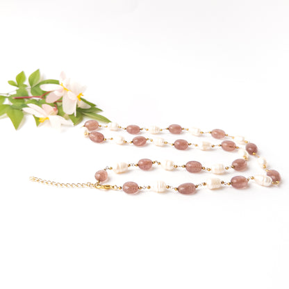 Strawberry Quartz gemstone jewellery with polished oval beads and pearls, perfect for elegant everyday wear or special occasions.