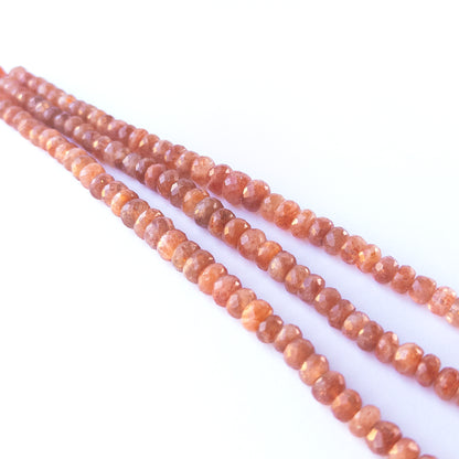 Handmade jewellery components featuring authentic Sunstone faceted rondelle beads with bright coppery shimmer.
