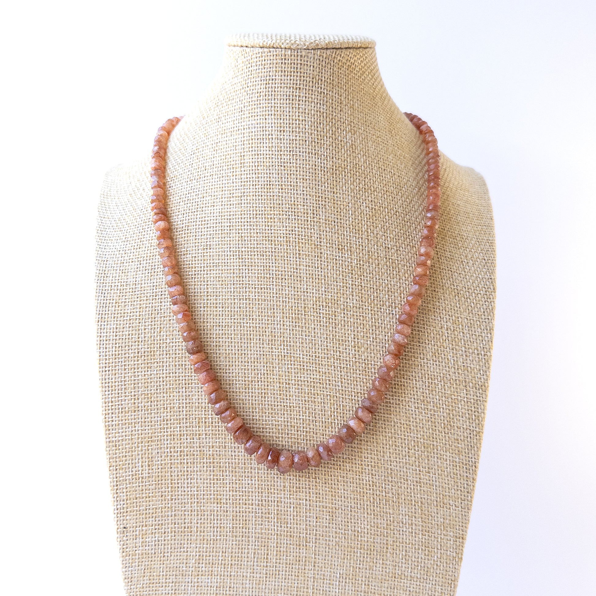 Warm glowing Sunstone faceted rondelle beads arranged in a 48cm necklace for handmade gemstone jewellery.