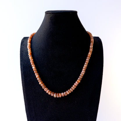 Authentic Sunstone stone beads showcasing peach shimmer and fine faceted rondelle detailing for designers.