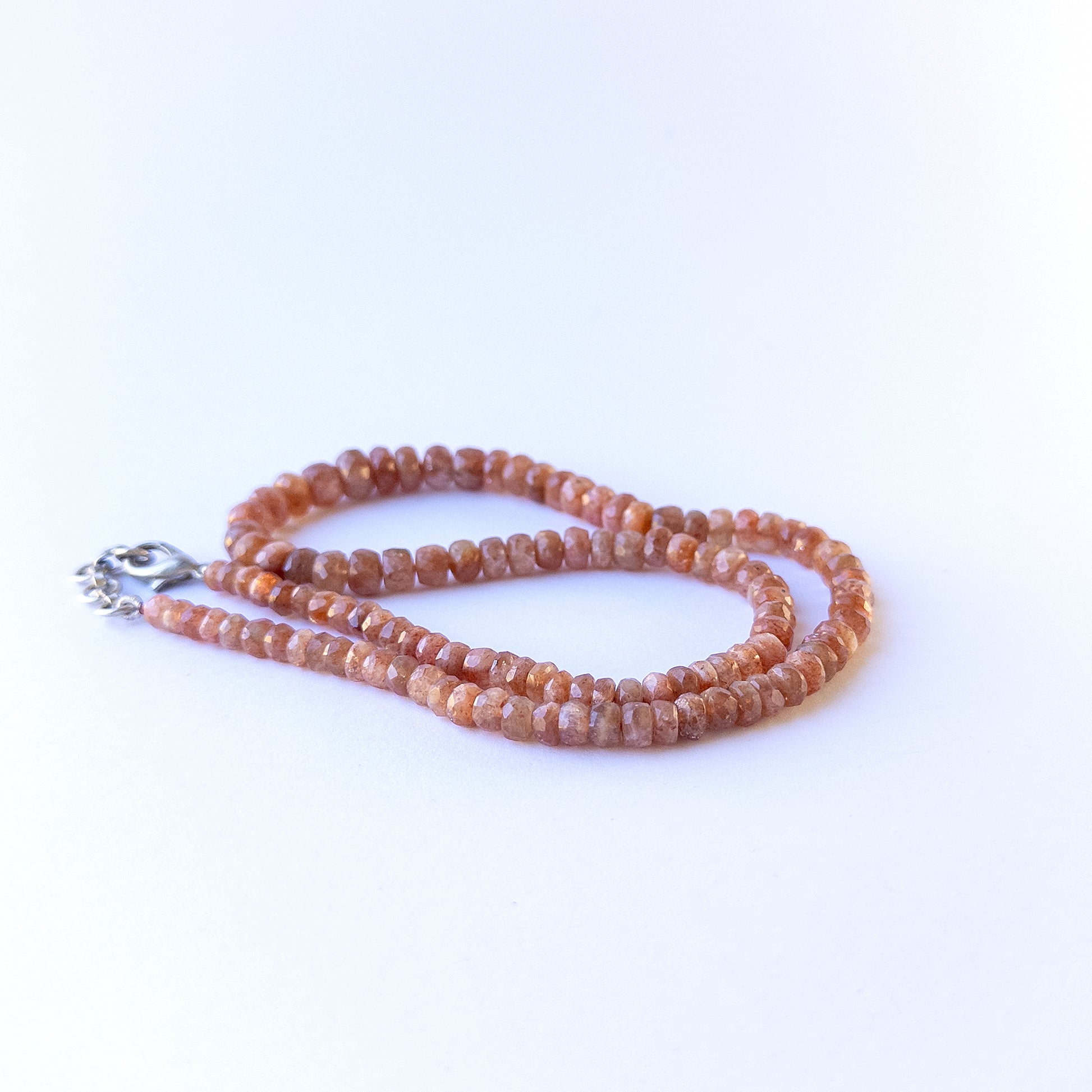 High quality Sunstone faceted rondelle beads in 6–8mm sizes, perfect for handmade jewellery components.