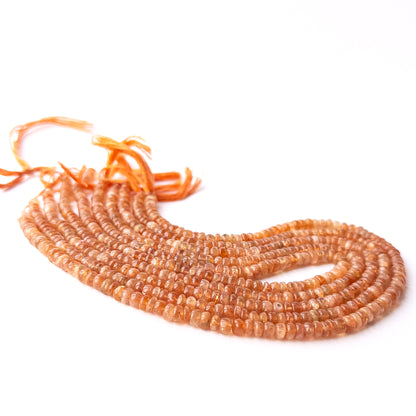 Genuine Sunstone gemstone beads in smooth rondelle cut, displaying polish, texture, and natural aventurescence.