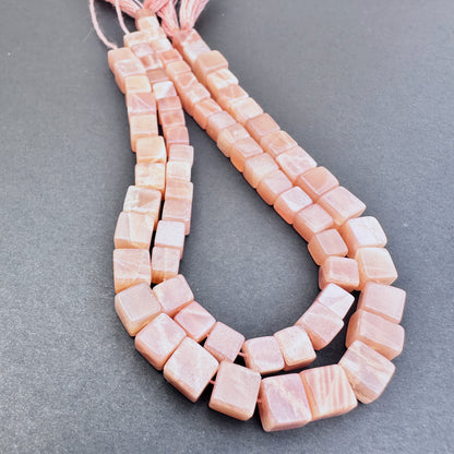 Sunstone stone beads with smooth square cut and radiant aventurescent shimmer.