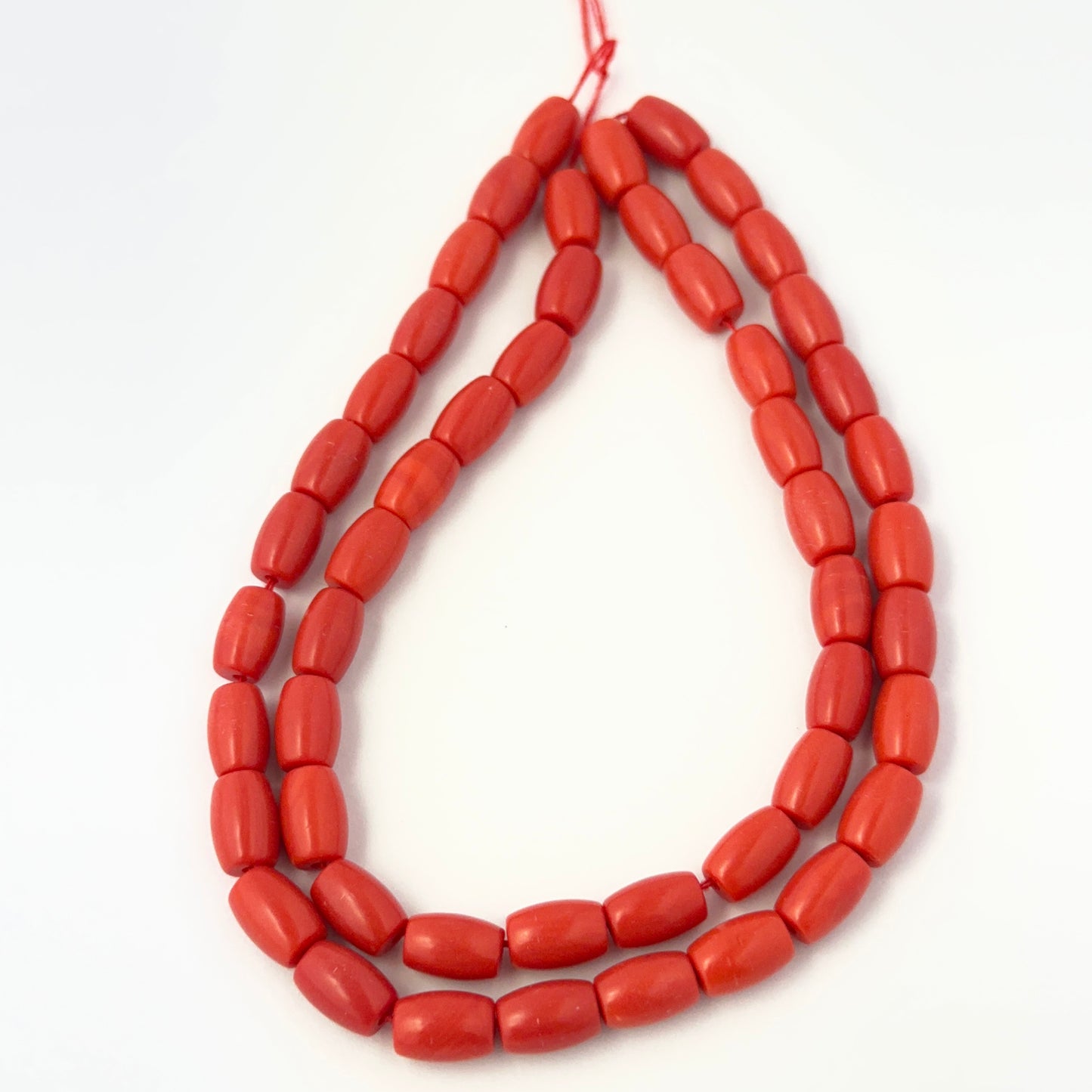 Taiwan Coral beads in 8.5mm x 6mm size arranged neatly for natural gemstone beads and DIY jewellery designs.