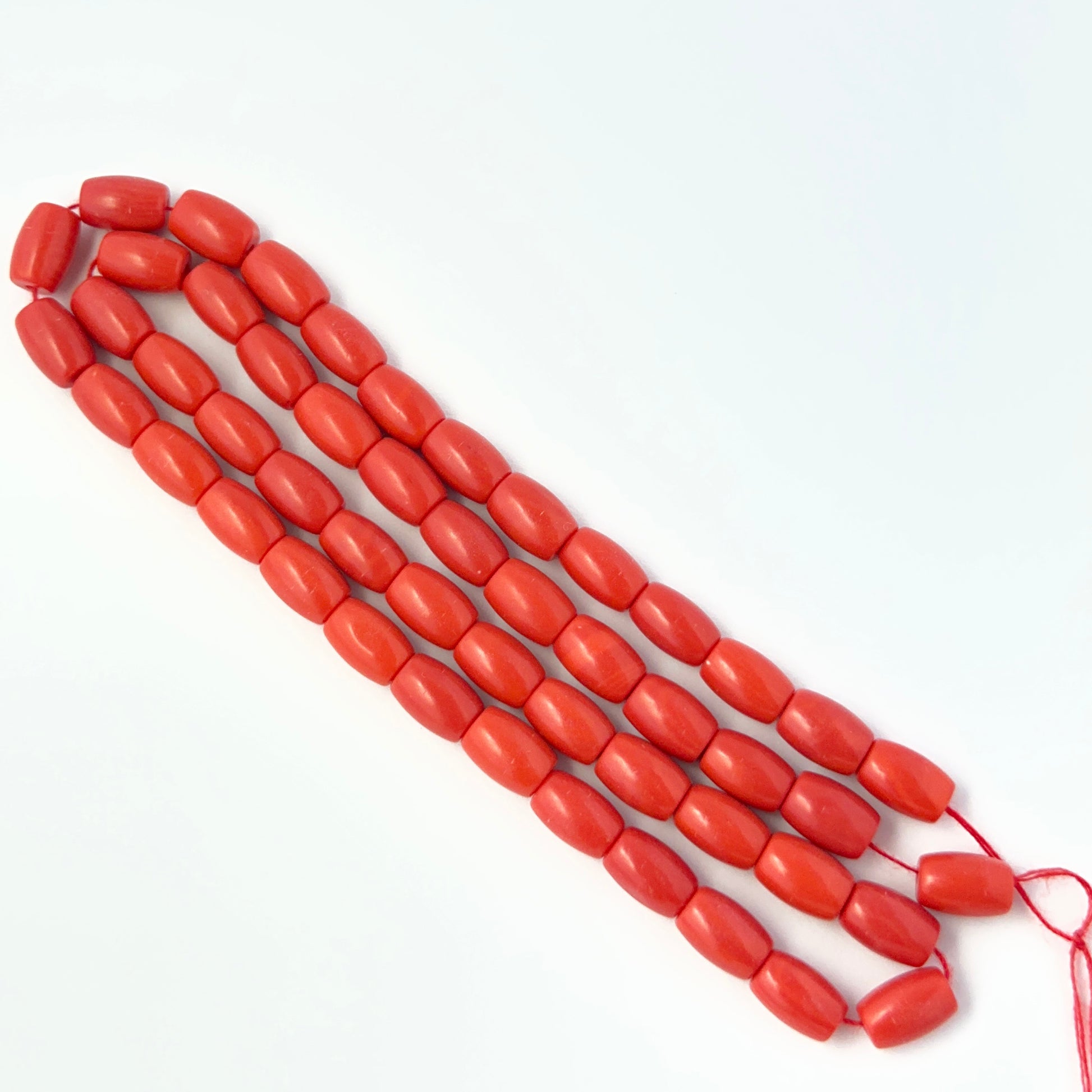 Close‑up of Taiwan Coral beads showing detailed surface texture and gemstone colour.