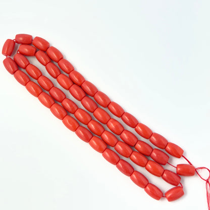 Close‑up of Taiwan Coral beads showing detailed surface texture and gemstone colour.
