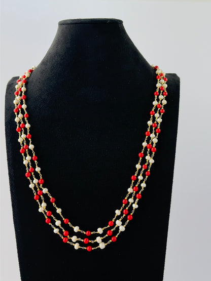 Elegant triple-strand coral and pearl necklace featuring smooth round beads in 48-52cm lengths.