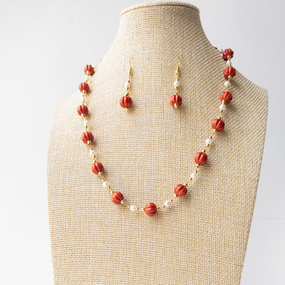 Genuine Taiwan Coral gemstone necklace set displaying rich colour, intricate carving and timeless handcrafted appeal.