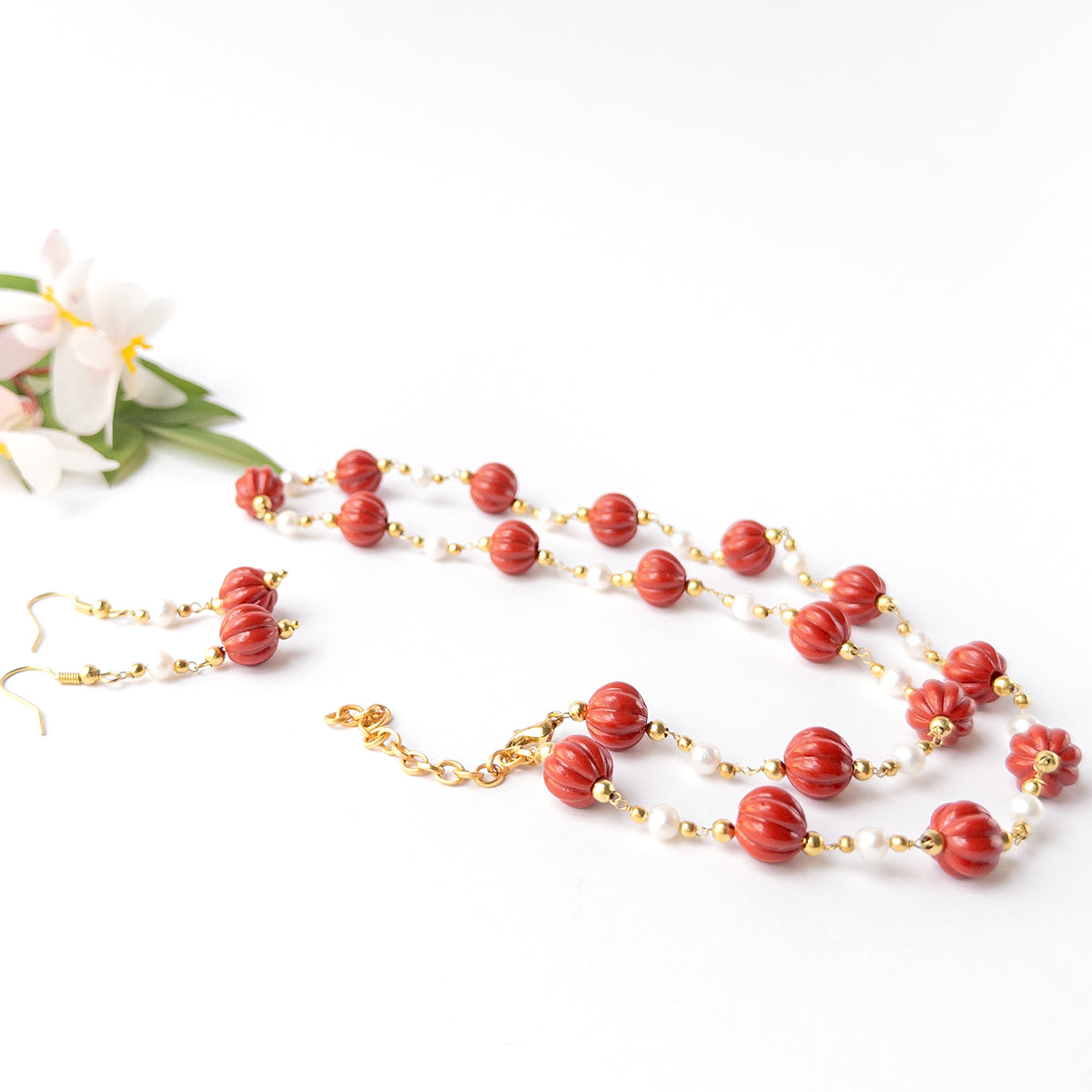 High quality Taiwan Coral gemstone necklace showcasing curved pumpkin beads with distinctive texture and vibrant colour.