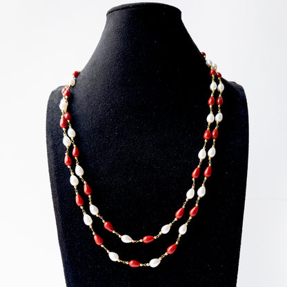 Handmade jewellery featuring smooth teardrop Taiwan Coral beads complemented by radiant Freshwater Pearls.