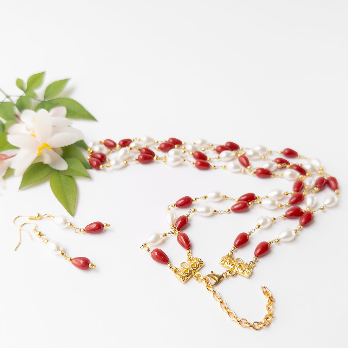 Two-strand Taiwan Coral and Freshwater Pearl necklace with matching drop earrings for special occasions and everyday sophistication.