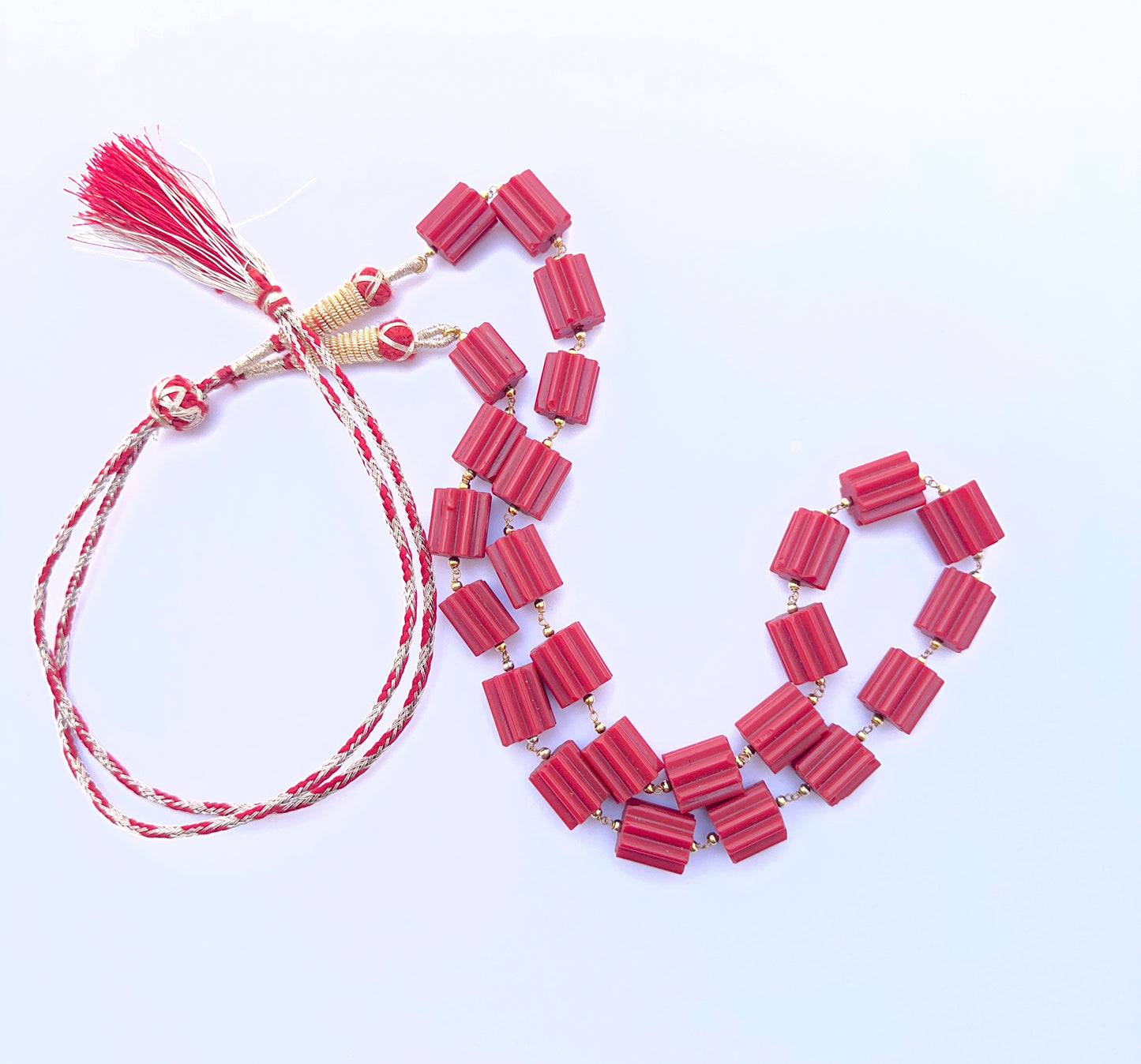 Elegant Taiwan coral necklace featuring cylinder‑cut beads in a striking design.