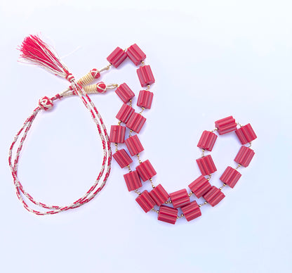 Elegant Taiwan coral necklace featuring cylinder‑cut beads in a striking design.