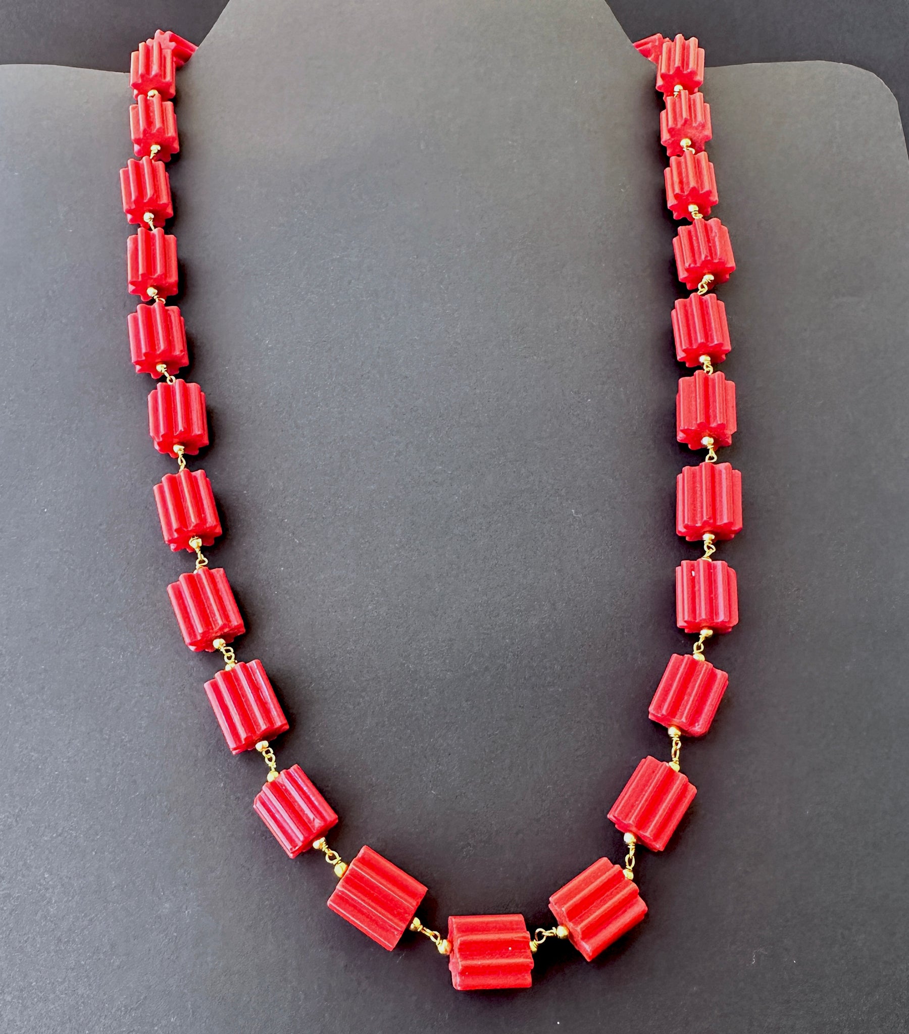Faceted cylinder coral stone beads necklace, 12x11mm, designed for timeless elegance and versatile styling.