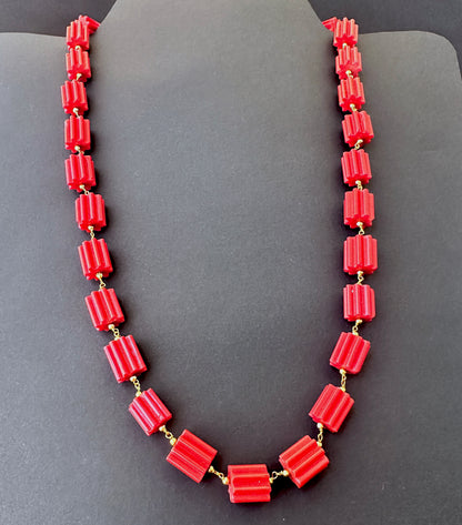 Faceted cylinder coral stone beads necklace, 12x11mm, designed for timeless elegance and versatile styling.