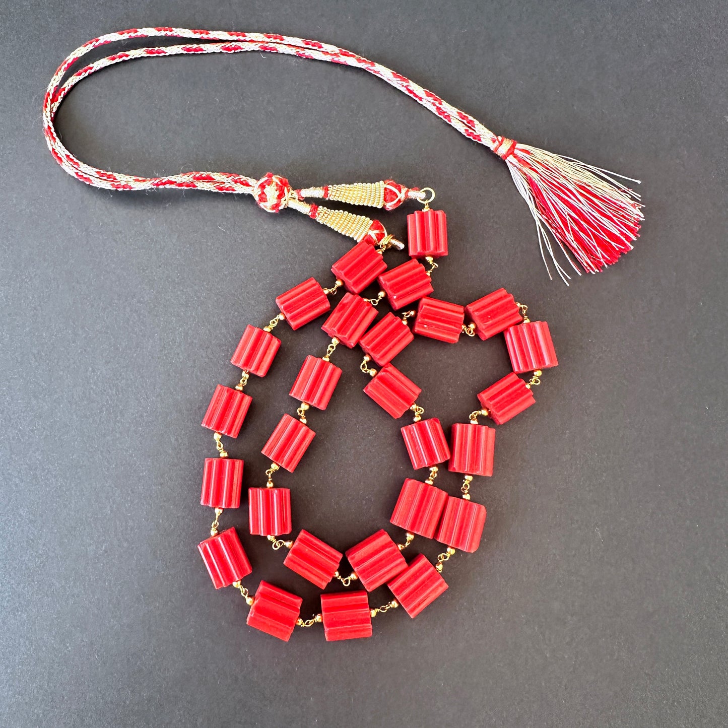 Close-up of Taiwan coral beads, 333 carats, highlighting clarity, polish, and natural gemstone brilliance.