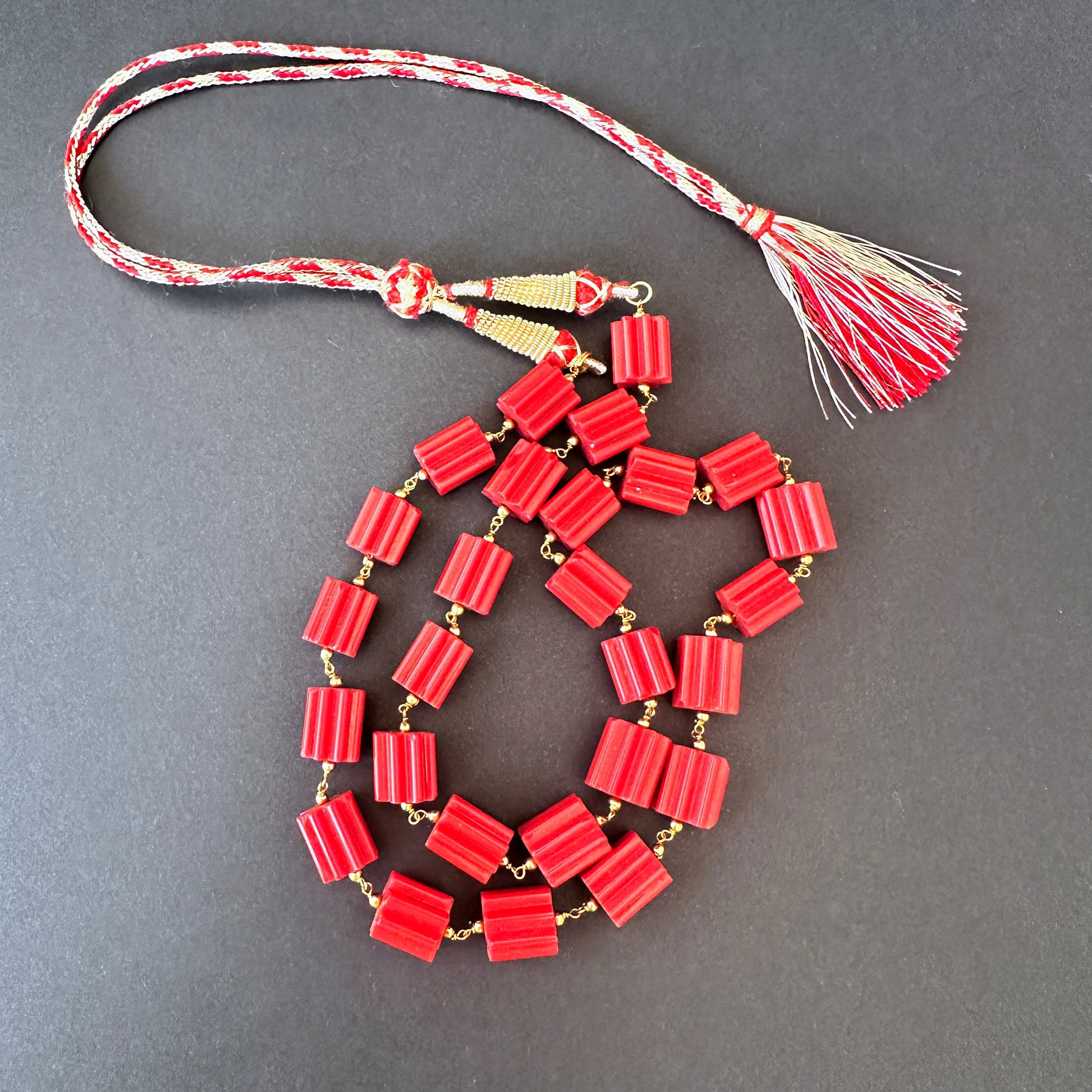 Close-up of Taiwan coral beads, 333 carats, highlighting clarity, polish, and natural gemstone brilliance.