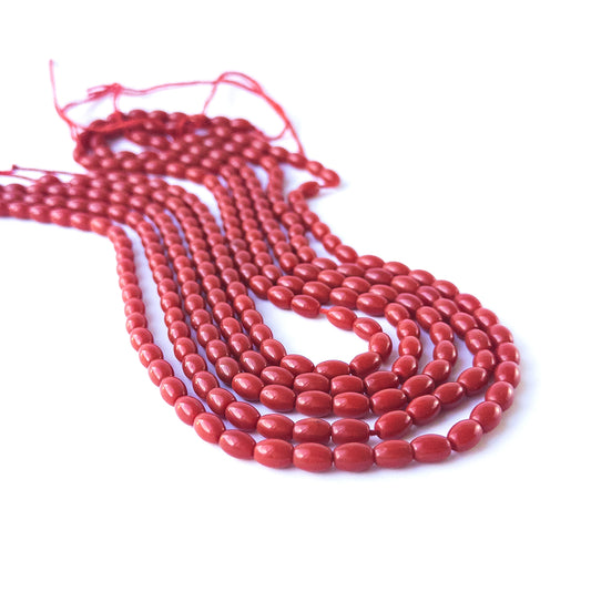 Smooth drum Taiwan Coral gemstone beads with refined polishing and soft organic hues for jewellery crafting.