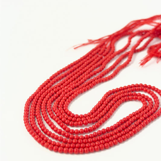 Smooth round Taiwan Coral beads showing bright colour and consistent handmade jewellery component quality.